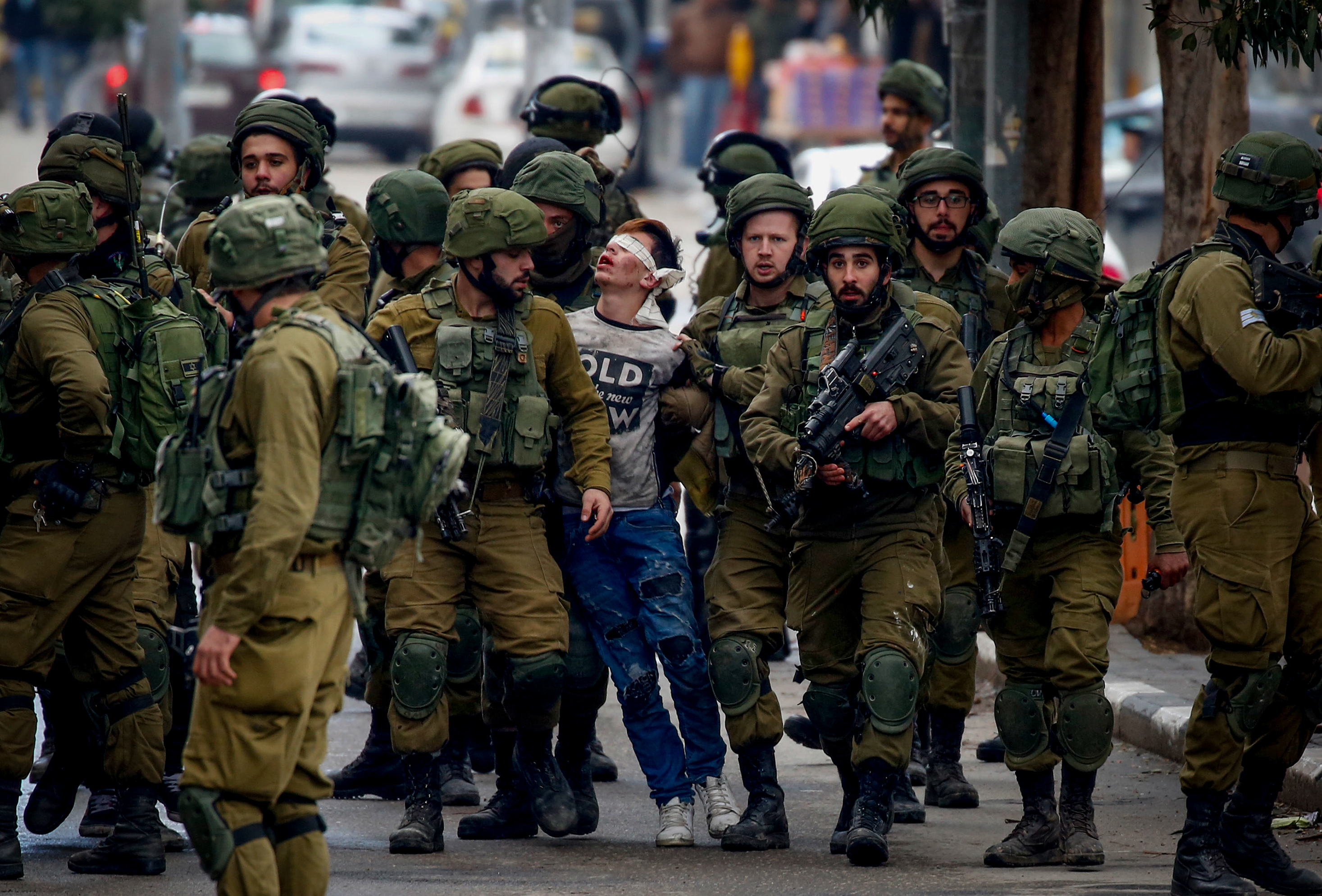 Fawzi al-Juneidi detained by Israeli soldiers in Hebron in 2017
